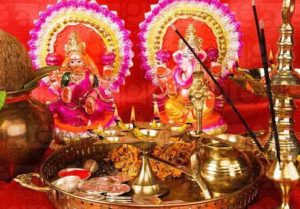 Diwali thali in front of idols of Lord Ganesha and Goddess Lakshmi